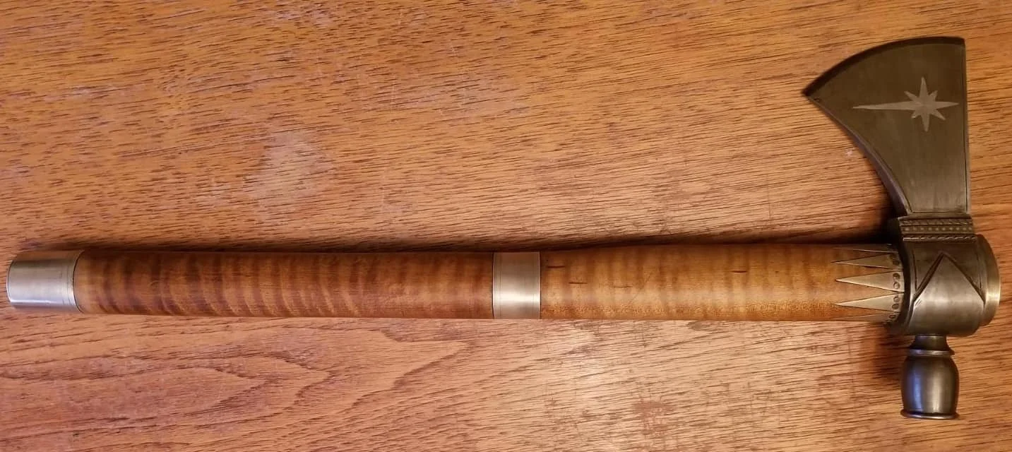 Completed pipe tomahawk featuring silver inlay and a hand-finished handle.