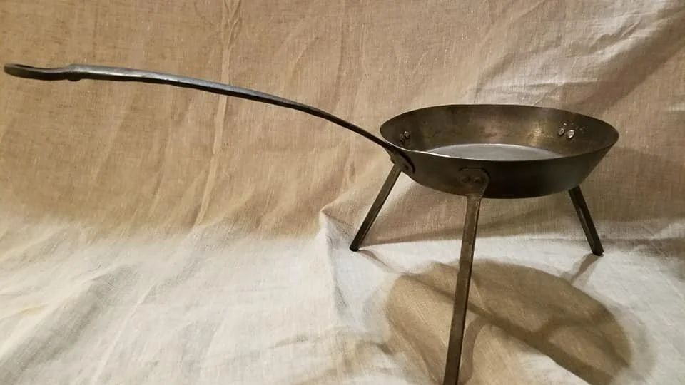 Spider skillet—designed with legs to lift it above the coals.