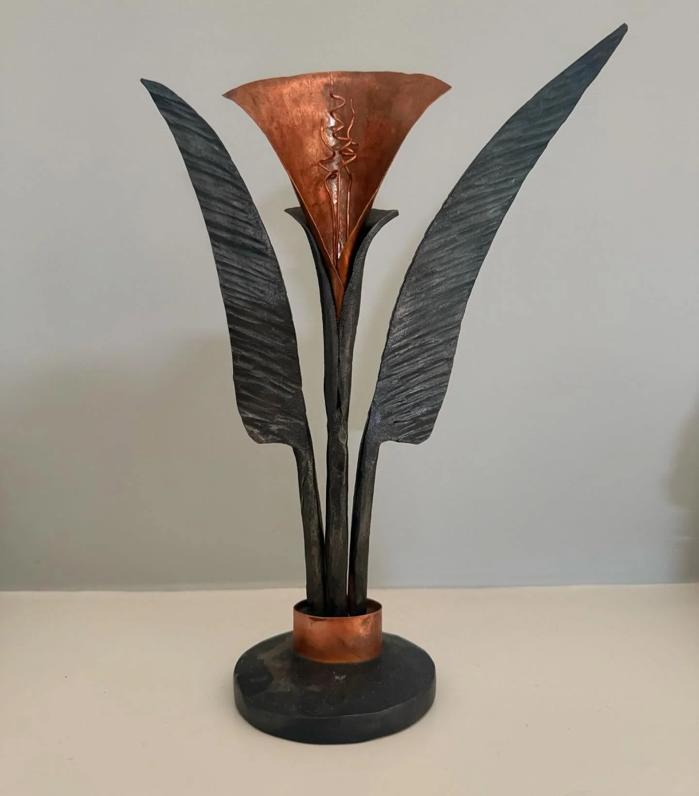 Hand-forged mixed media flower in steel and copper, inspired by calla lilies, made for my wife.