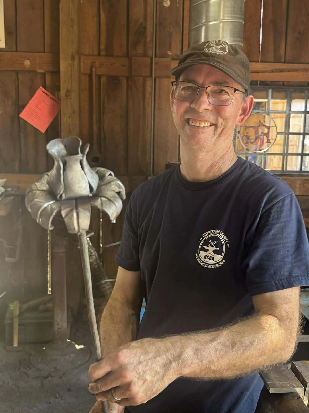 Rob Robinson holding one of flowers he made for RCBA project at TN State Fair August 2025 