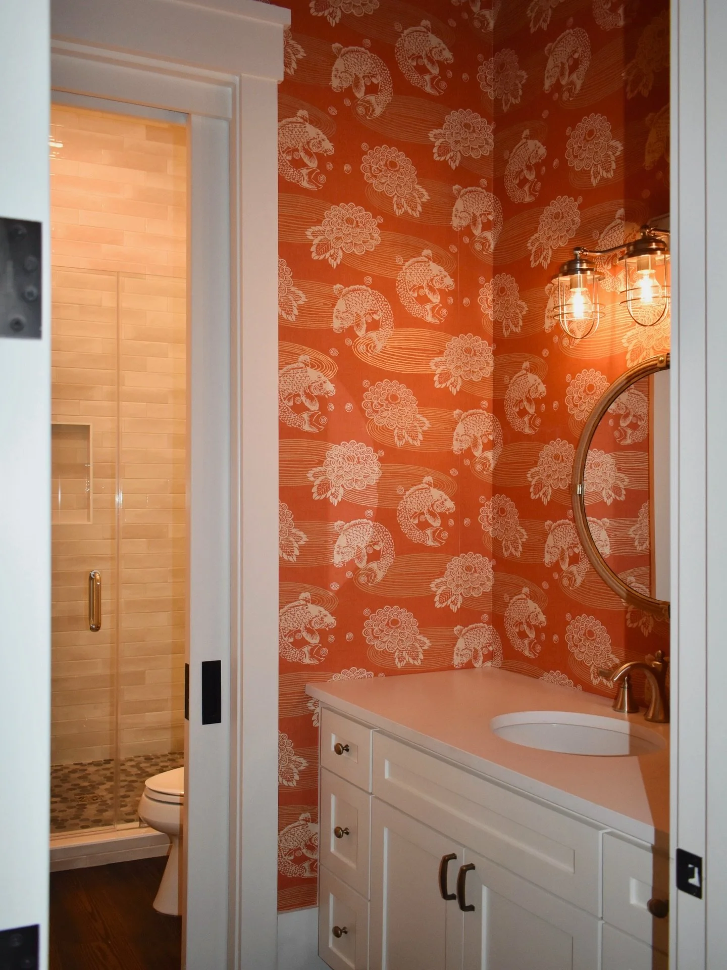 Absolutely loving this orange koi fish wallpaper for this hall bath 🏵️