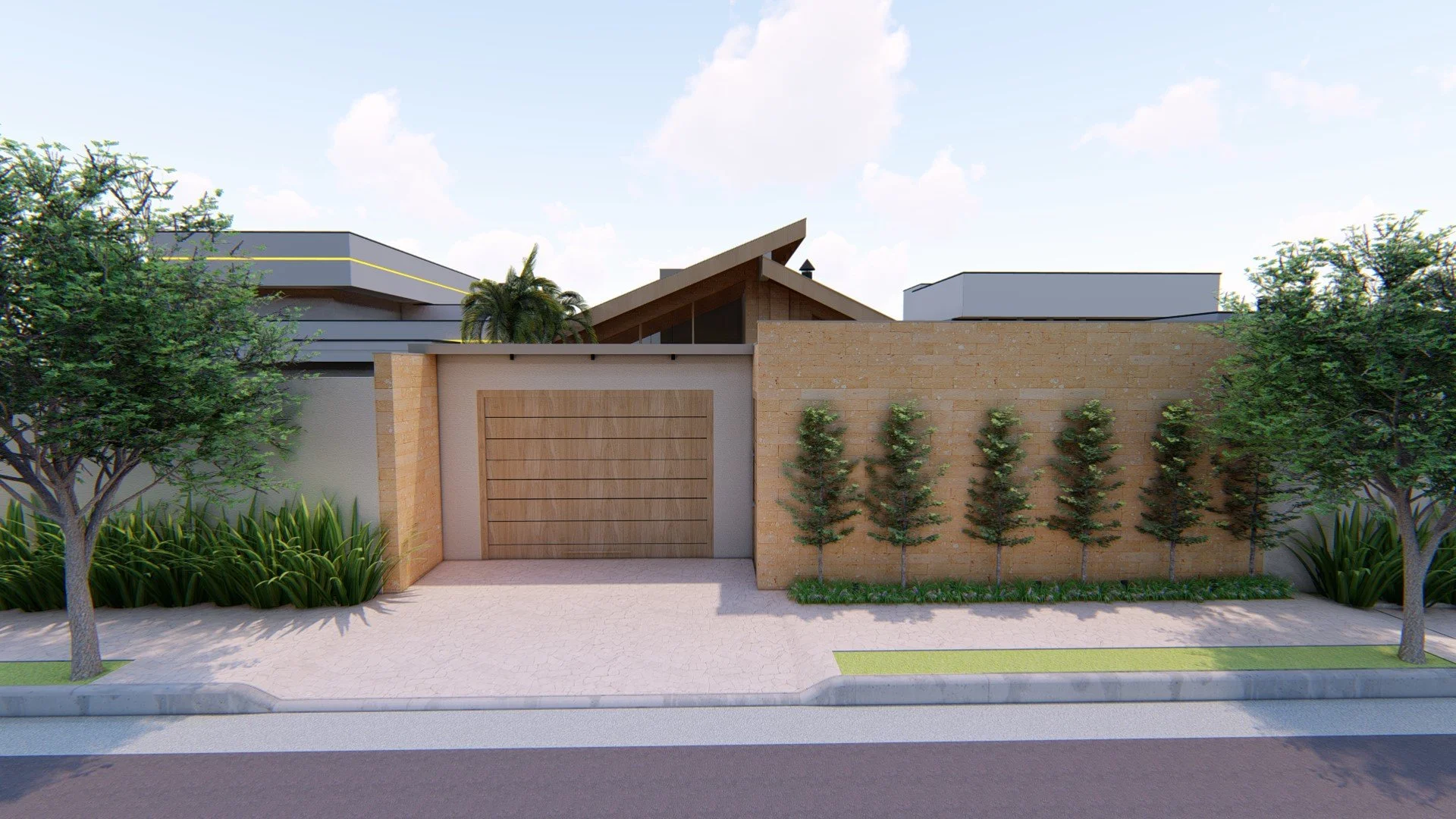 A modern residential front yard with a textured concrete driveway, two trees on either side, a brick and concrete wall with a wooden gate, and a row of small trees along the wall.