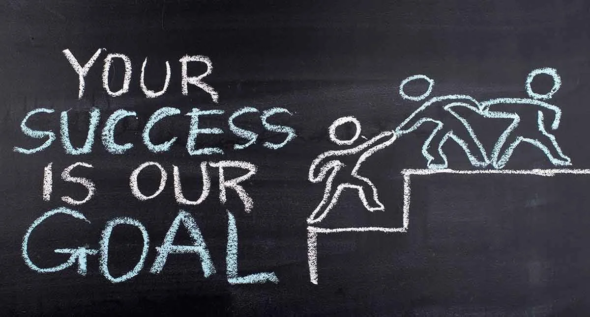 People helping others up a staircase