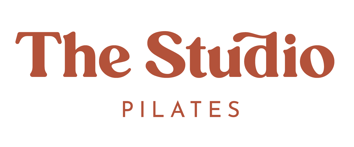 Logo for The Studio Pilates in brown text.