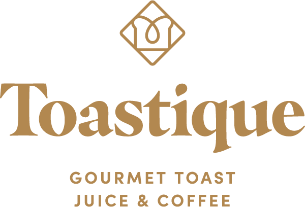 Toastique logo with a stylized emblem above the text, indicating a focus on gourmet toast, juice, and coffee.
