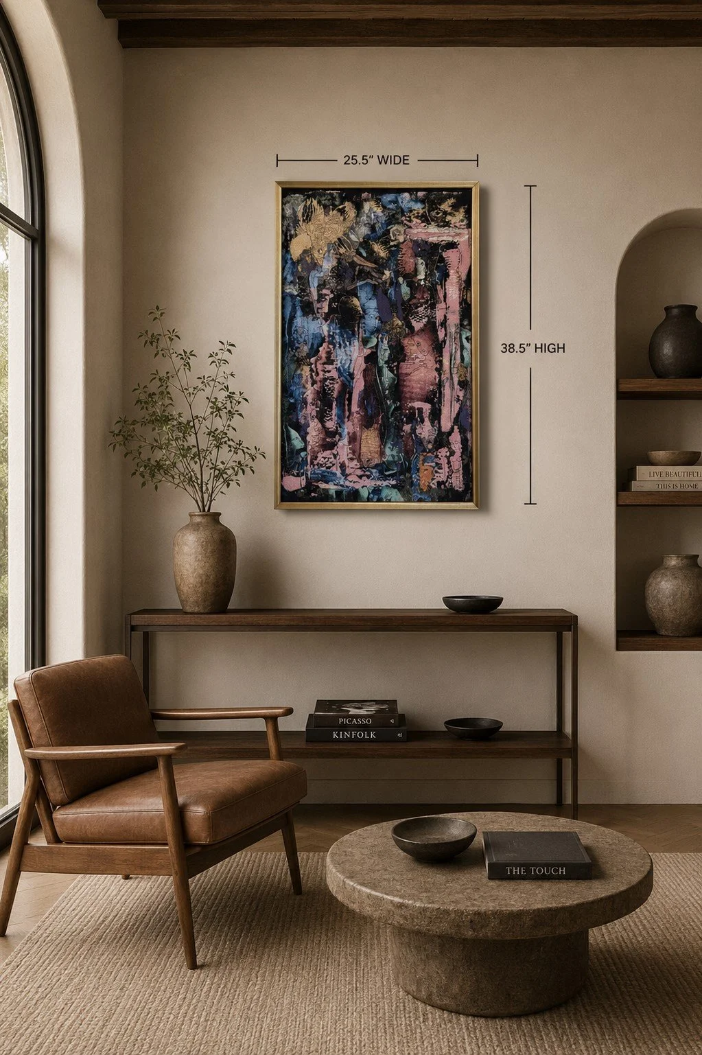 Framed limited edition tapestry "Strangers in Strange Lands" displayed above a modern console in a contemporary living room, dimensions 38.5 × 25.5 inches.