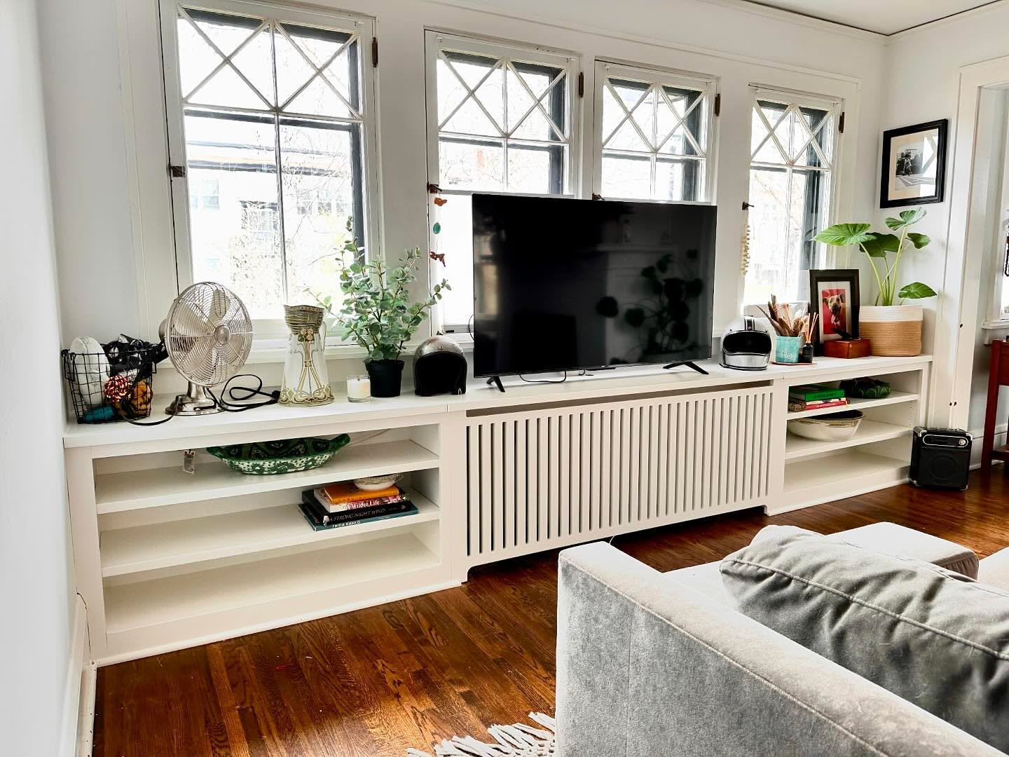 Such a big fan of how this turned out. Sometimes little things like radiators can stop you from making a space work how you want it to. The radiator virtually disappears and the built in bookshelves make it look like the unit was always there.