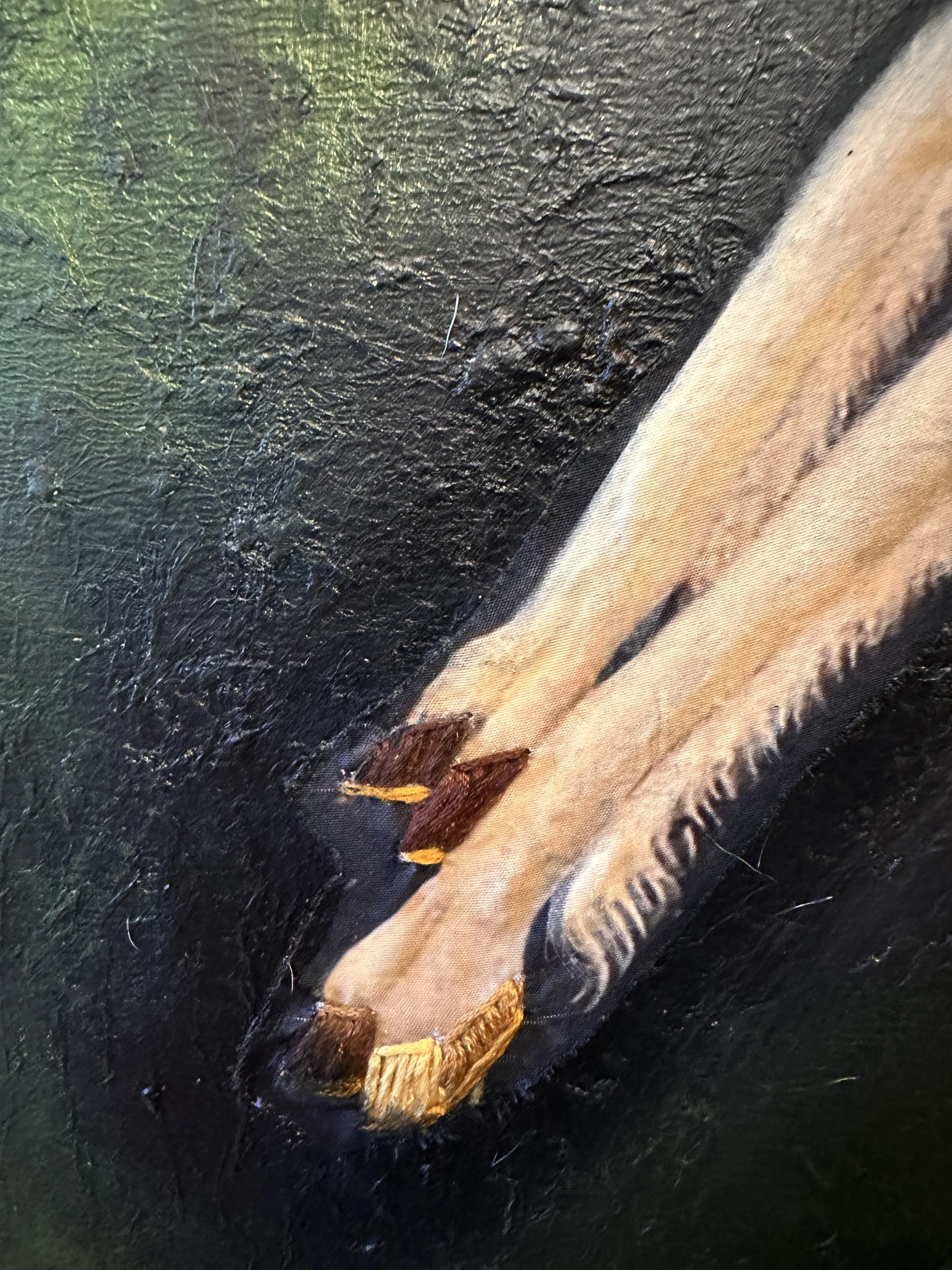 Close-up of thecanvas showing the attention to detail, materials, and the textured background.