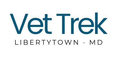 Logo with the words 'Vet Trek' in blue and black text.