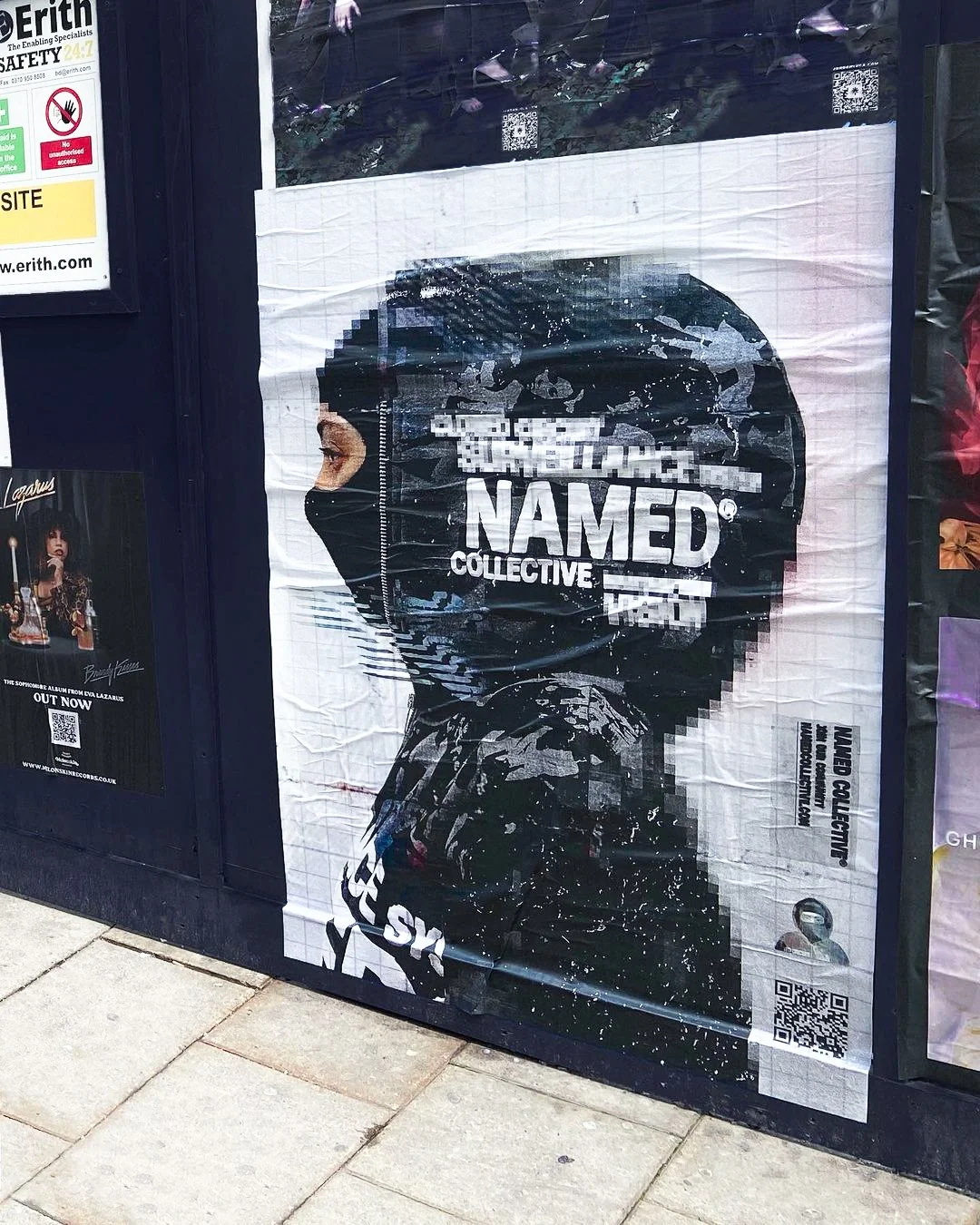 Named Collective “Surveillance” street poster campaign featuring glitch-inspired graphics, distorted portrait imagery and cyber-inspired branding installed as large-scale flyposting artwork in London.