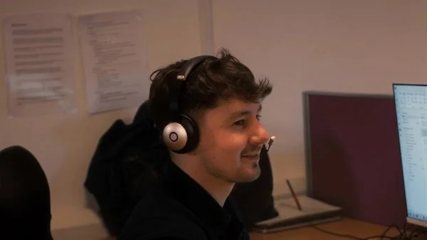 Member of P4 team giving aftercare support with a telephone headset