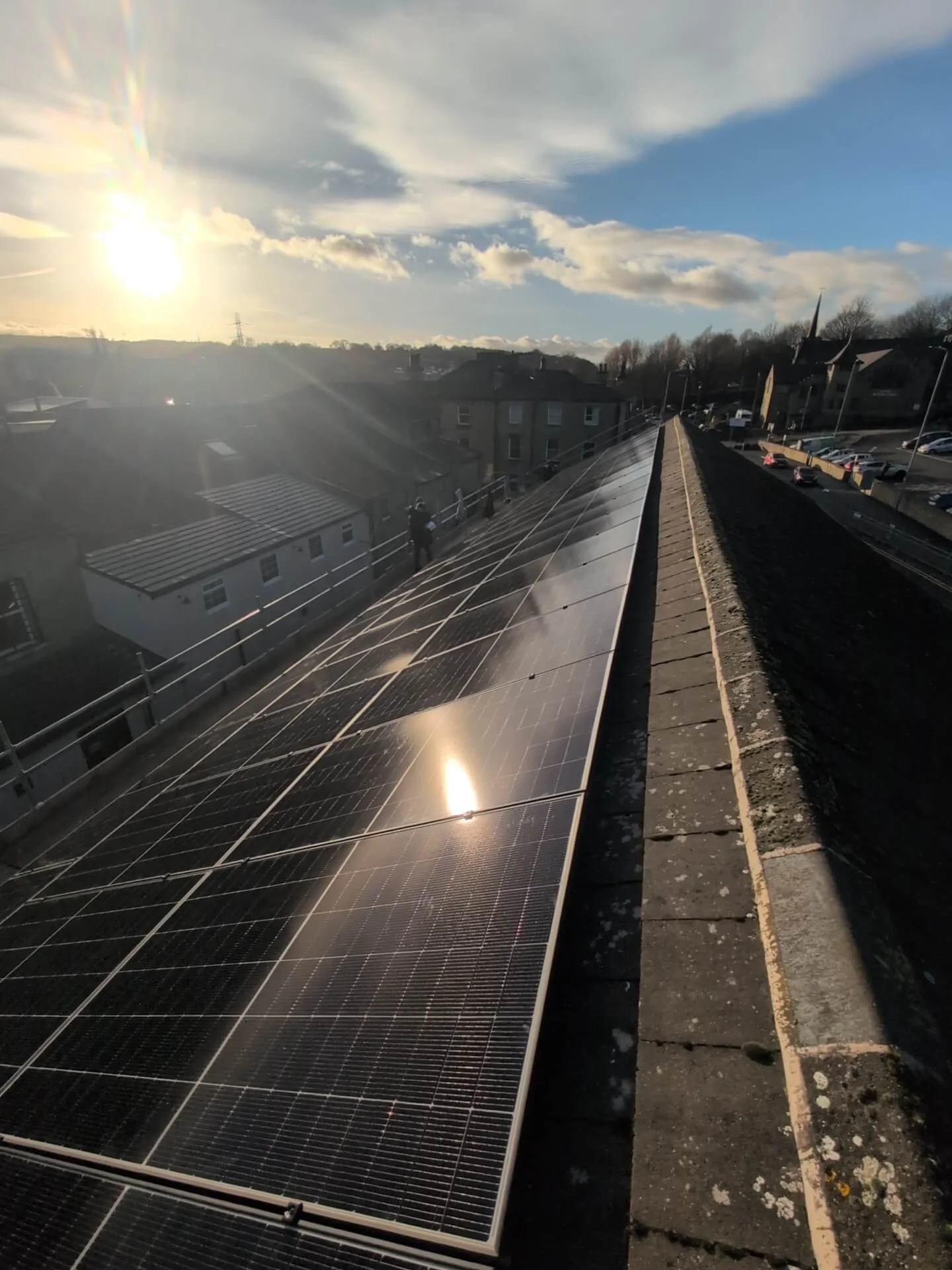 Commercial office rooftop fitted with solar panels generating renewable energy for office operations.