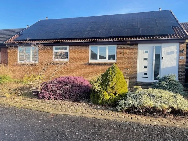 Stone bungalow with solar panels installed on the roof, Silsden and Keighley area