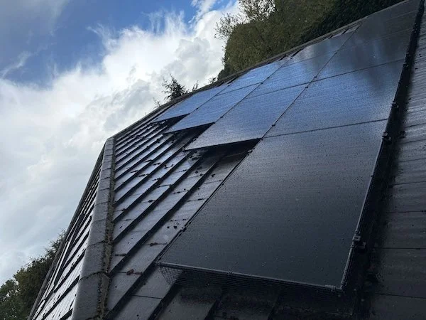 Close-up of solar panels installed on a tiled roof