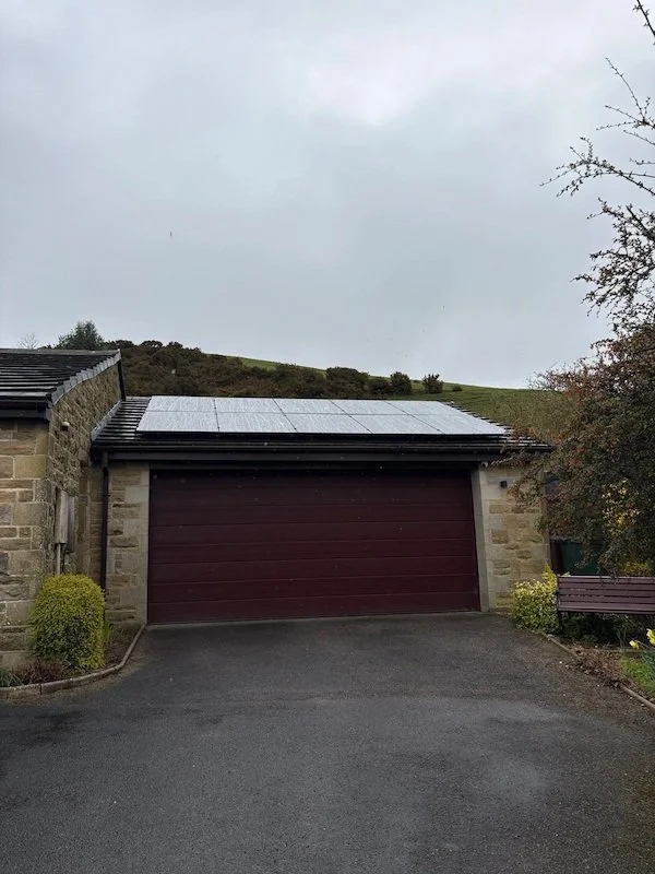 Tiled-roofed garage or outbuilding with solar panels installed, Skipton and Wakefield area