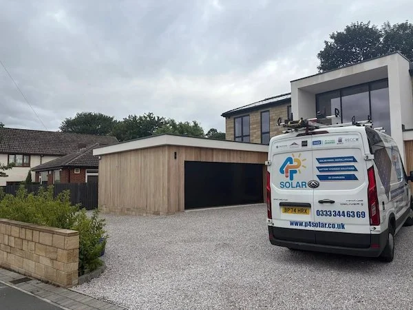 P4 Solar van parked outside residential property with solar panels