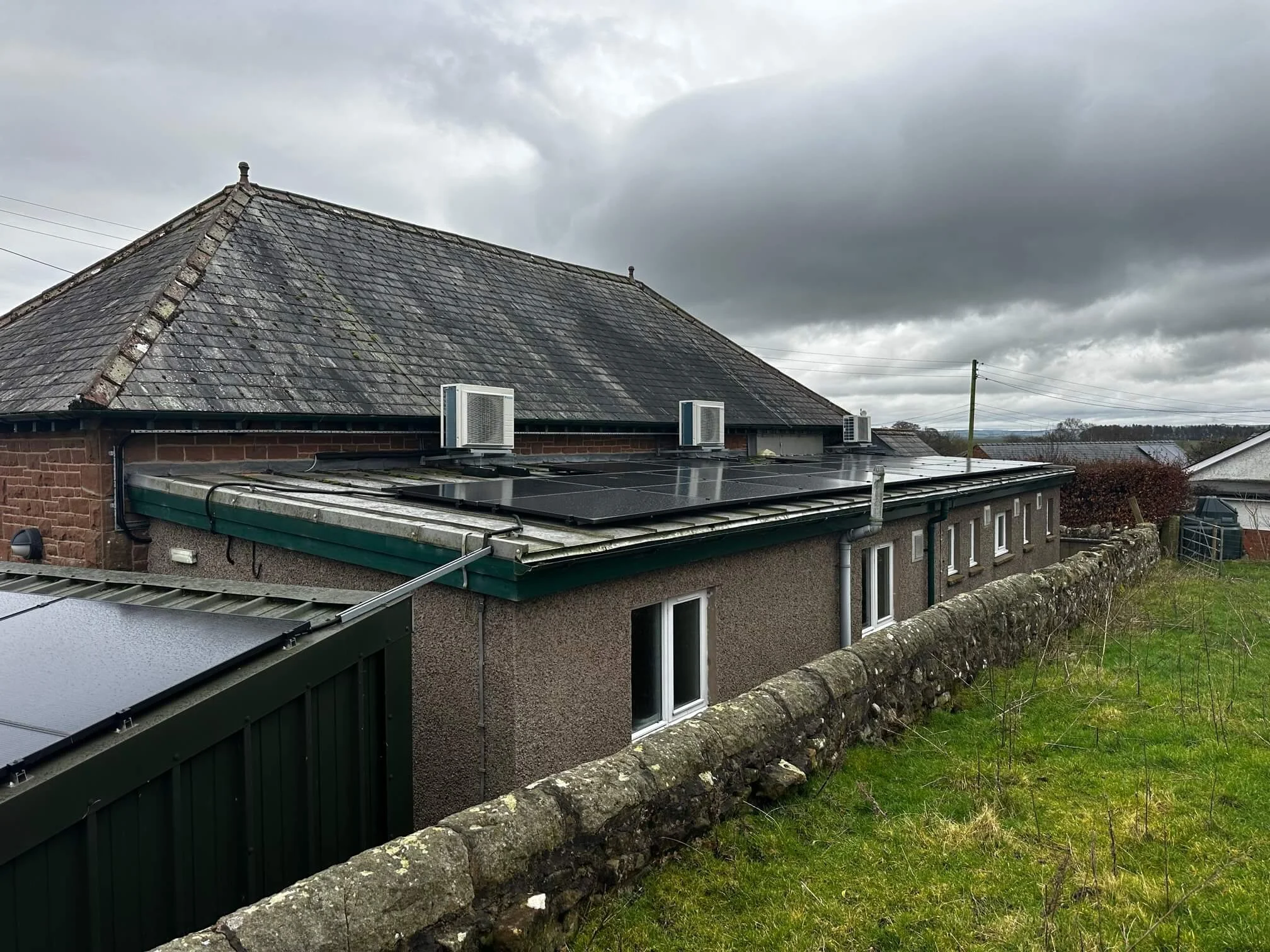 Completed solar PV array on a rural village hall building