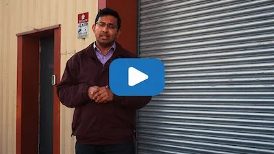 Business owner discussing the benefits of a commercial solar panel installation by P4 Solar.