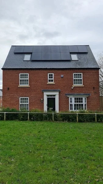 Modern detached house with solar panels installed on the roof, Manchester