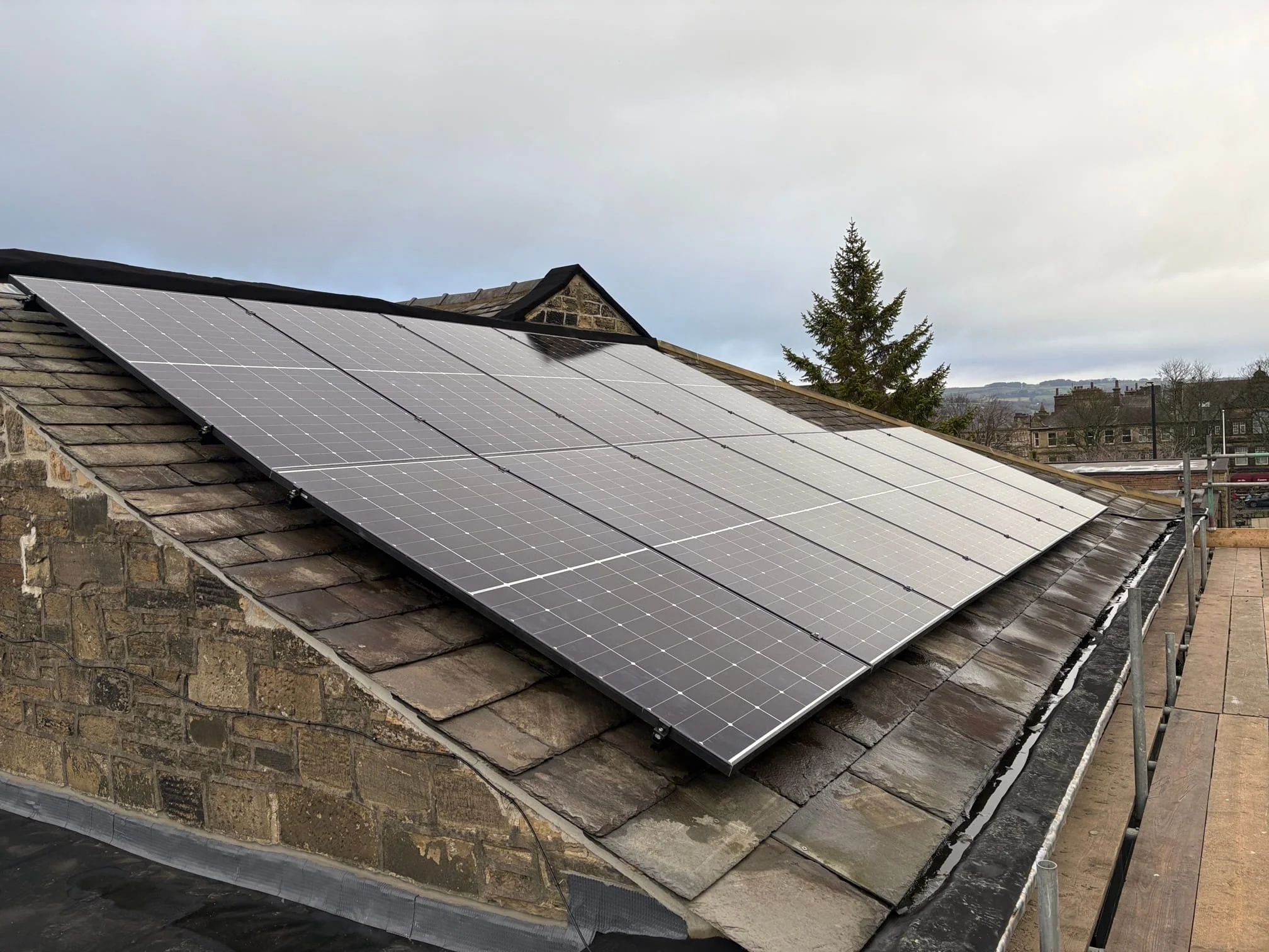 Solar panels installed on the roof of Keighley Healthy Living Network community building in West Yorkshire.