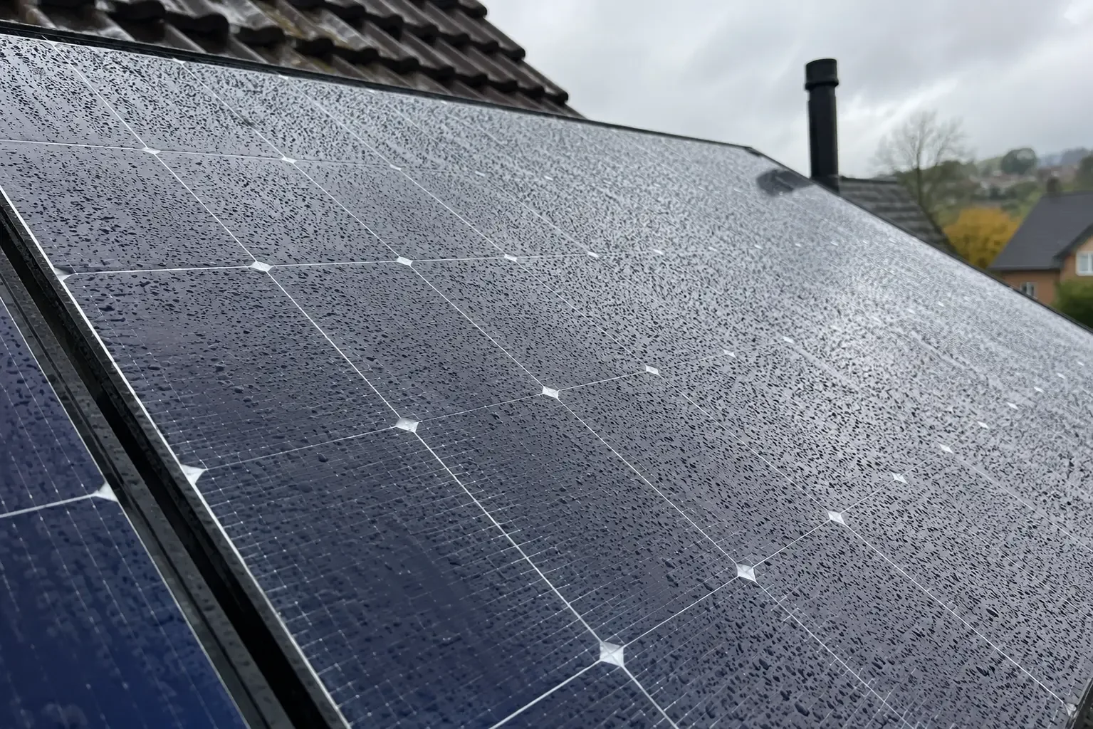 Raindrops on solar panels fitted on a roof