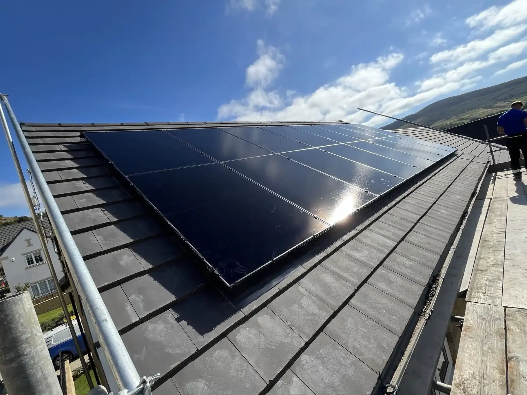 Residential rooftop solar panel installation generating renewable electricity for a modern home.