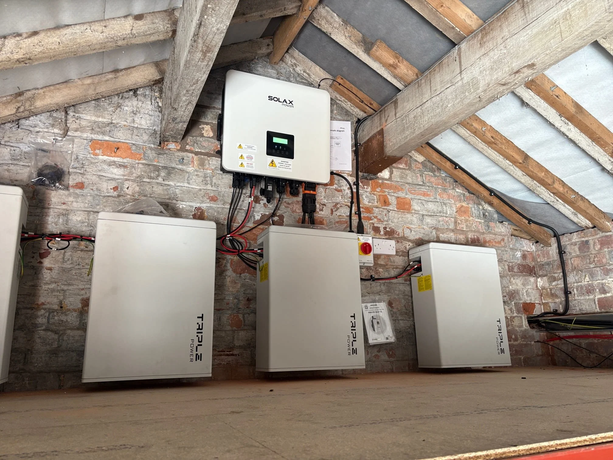 Commercial battery storage system and inverter installation for business energy management.