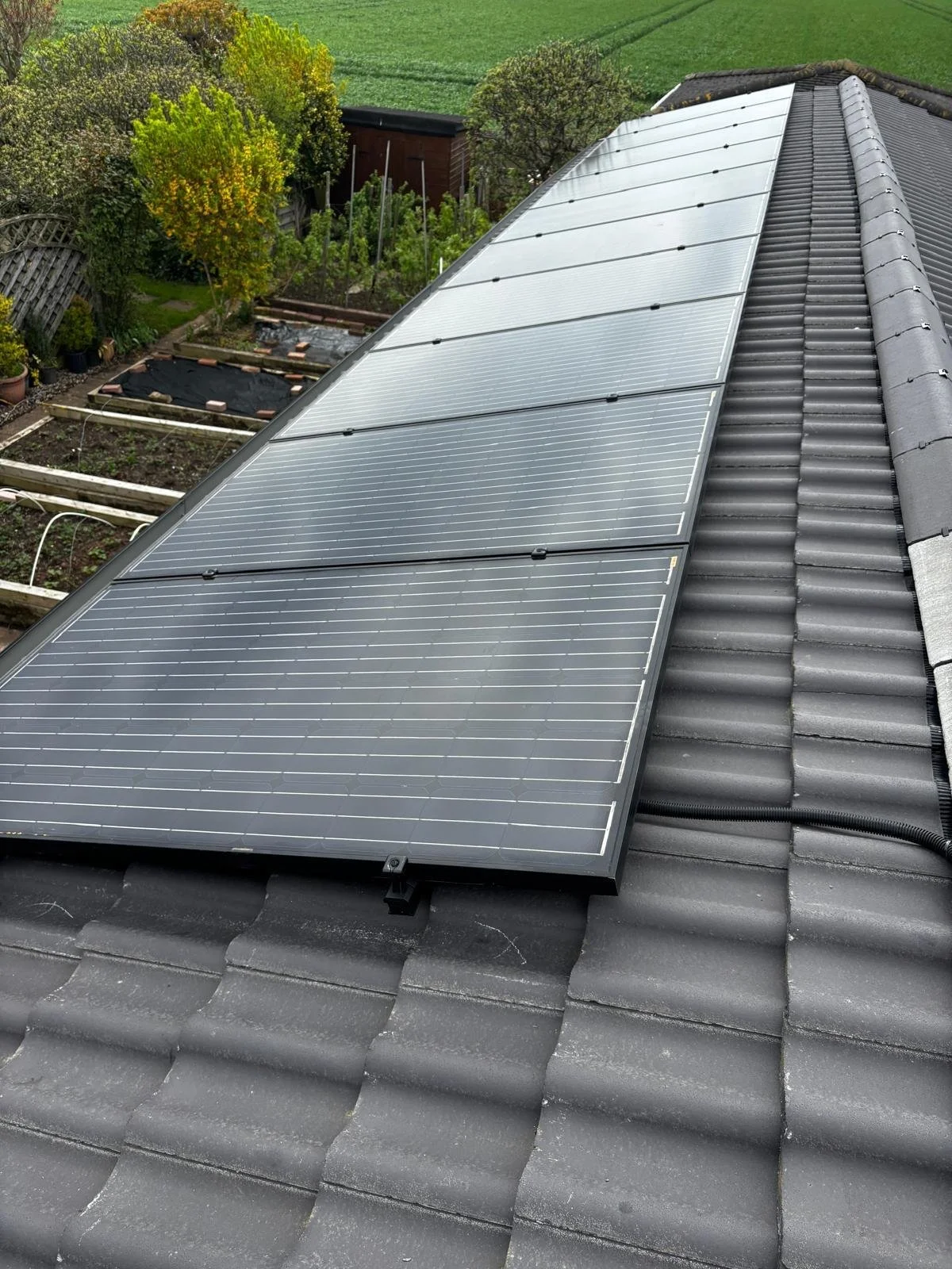 Residential property near Ripton with on-roof solar panel installation