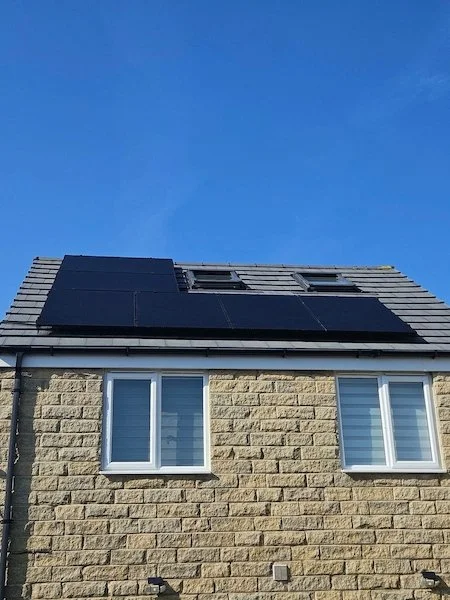 Detached house with solar panels installed on the roof, Keighley area