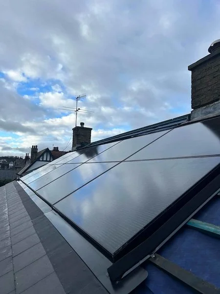 Close-up aerial view of solar panels installed on a pitched roof, Ilkley