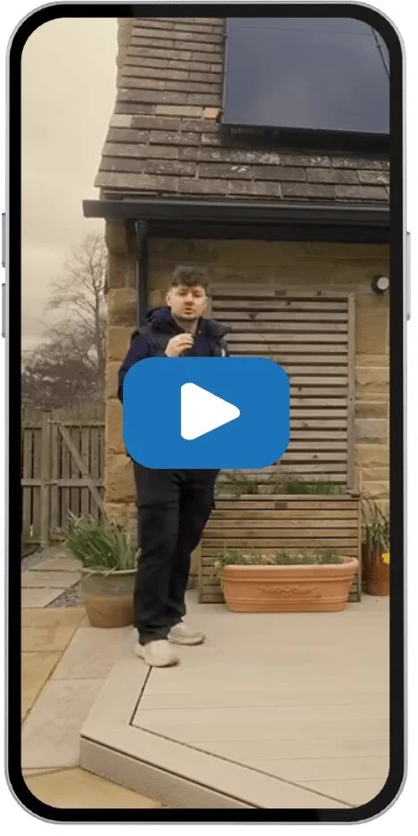 Thumbnail for Myth Buster video explaining whether solar panels are expensive, showing a homeowner outside a house with rooftop solar panels.