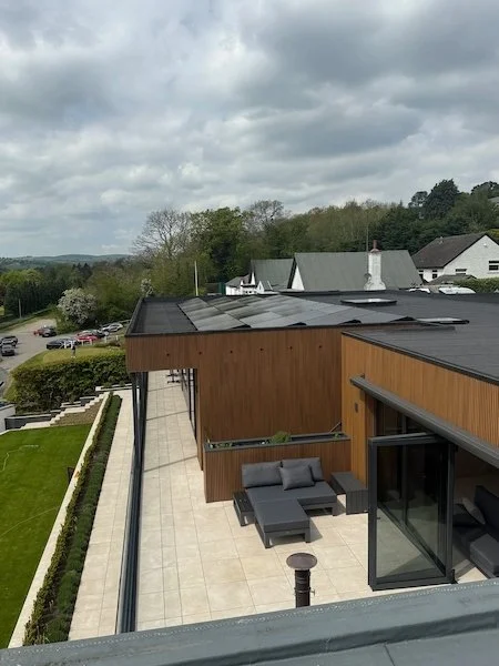 Detached modern house with solar panels installed on the roof, Ilkley