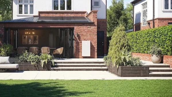 Tesla solar battery on external wall of white-rendered residential home