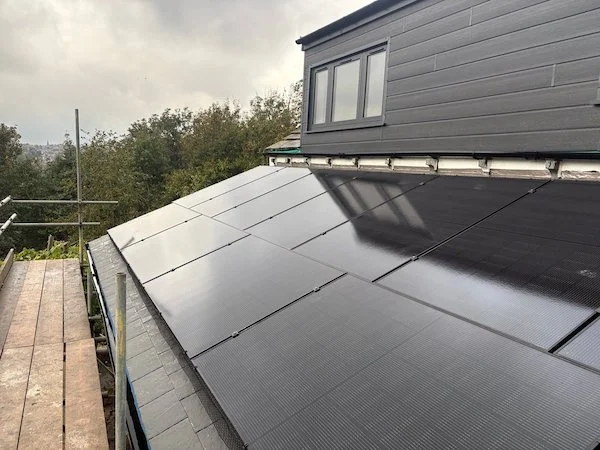 Close-up aerial view of solar panels installed on a roof