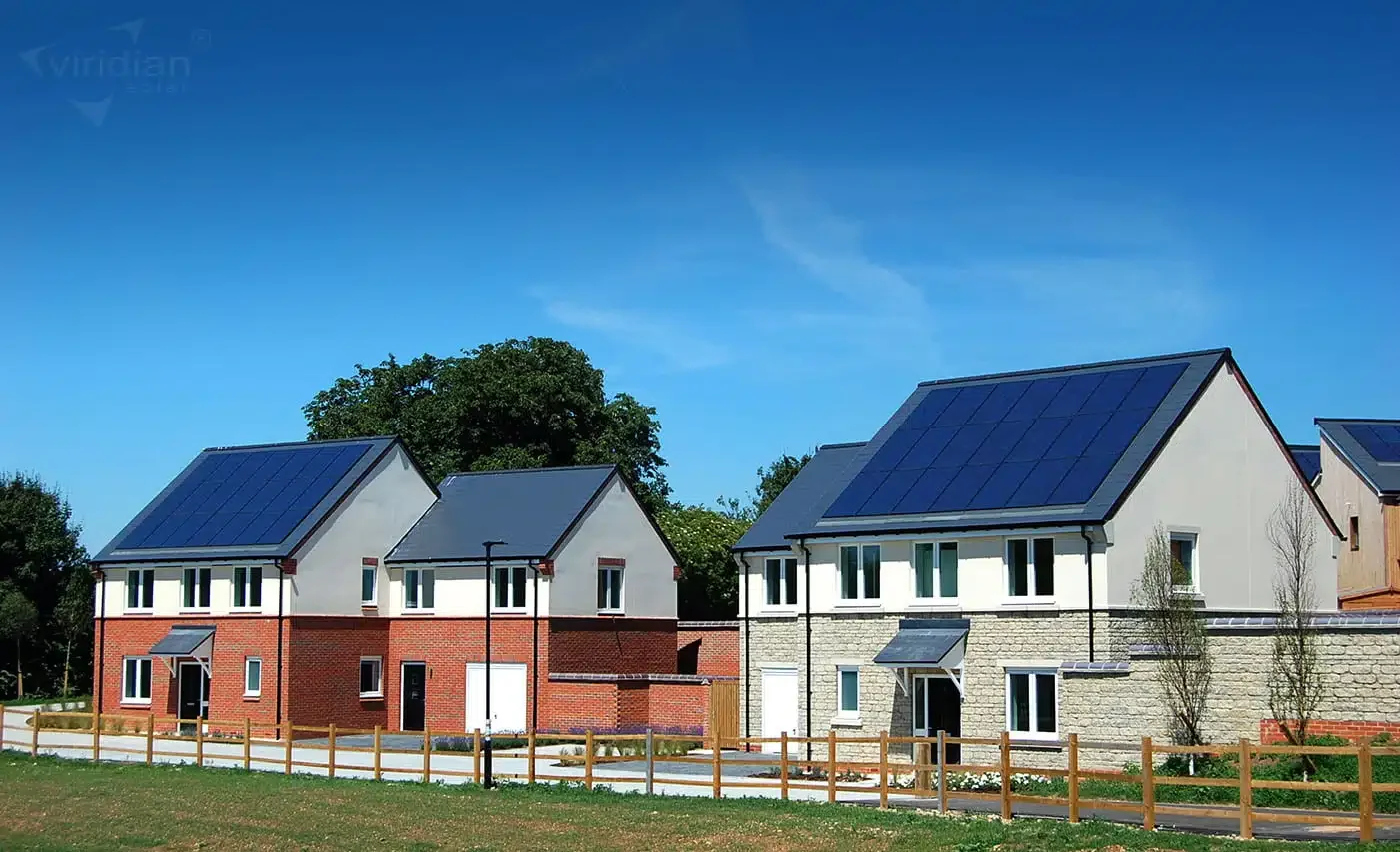 Residential new-build development featuring solar panel systems installed on multiple properties.