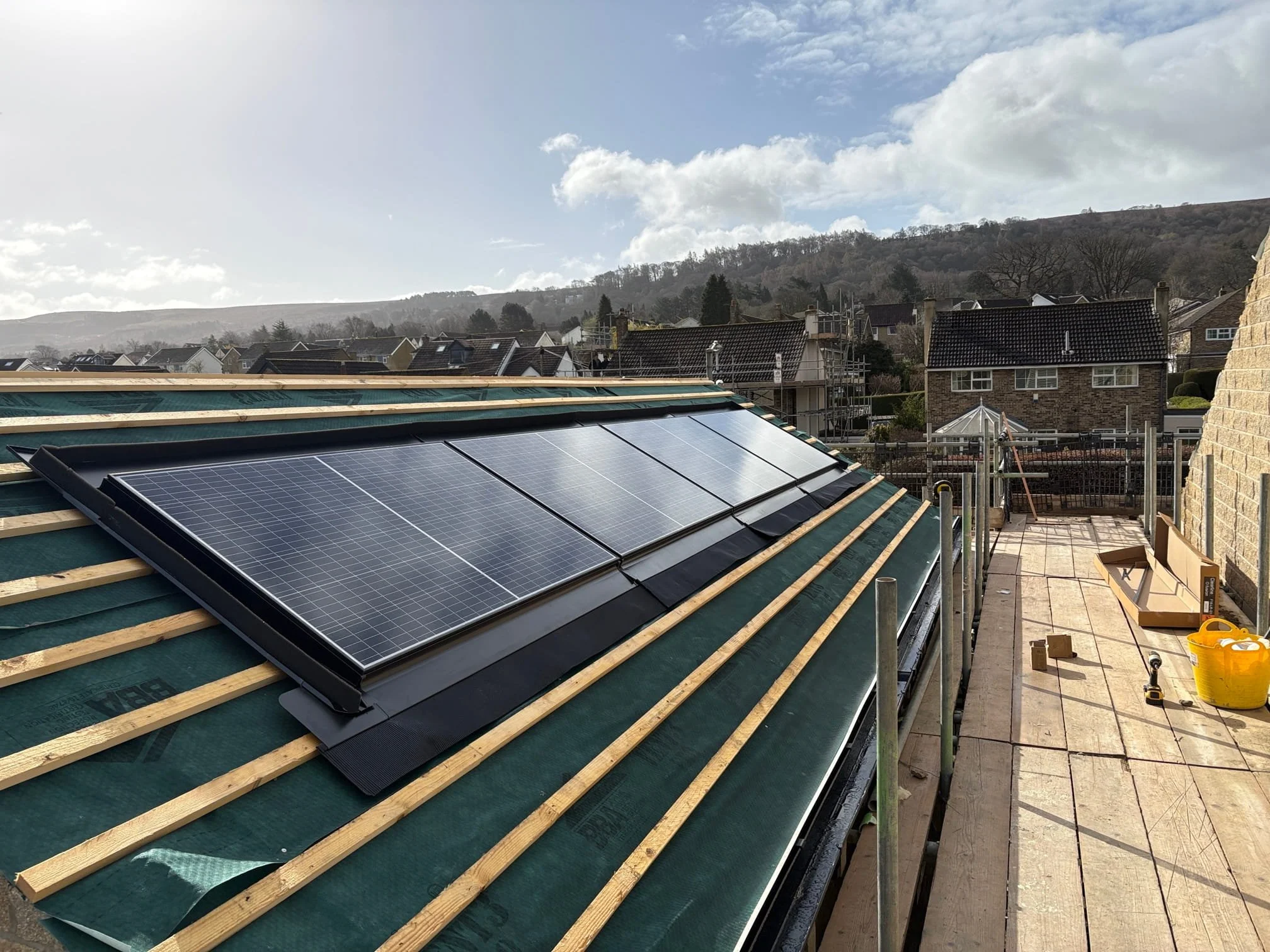Solar panel system installed on the roof of a newly constructed residential building by P4 Solar.