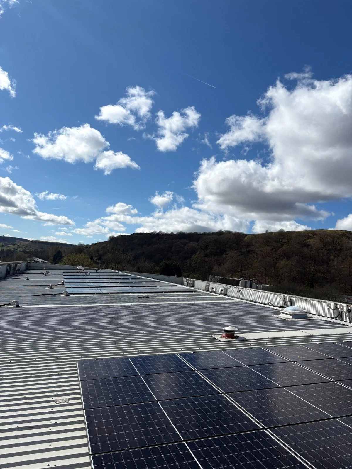 Solar panels generating renewable energy under blue skies in Yorkshire