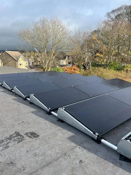 Solar panels installed on the roof of Burley Library, community solar installation, Ilkley area