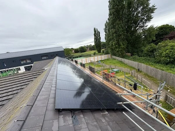 Commercial solar installation on a pitched roof providing renewable energy for a business premises