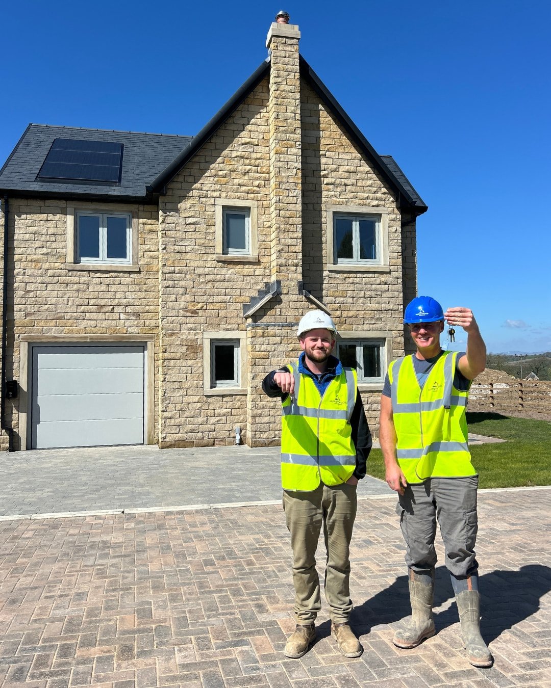 Commercial rooftop solar installation during commissioning and final handover stage for a new build project.