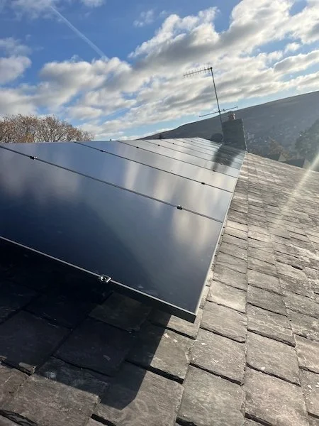 Close-up of solar panels installed on pitched residential roof