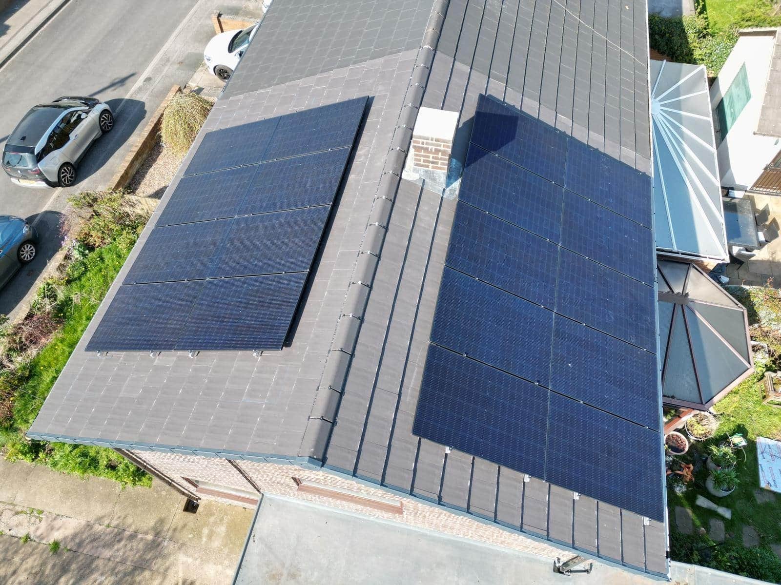 Commercial rooftop solar panel installation on industrial building