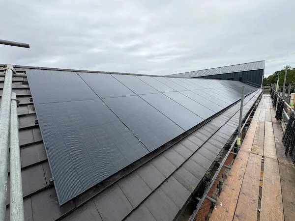Solar panels fitted along the roof of Ivy Lane School as part of a sustainable energy upgrade.
