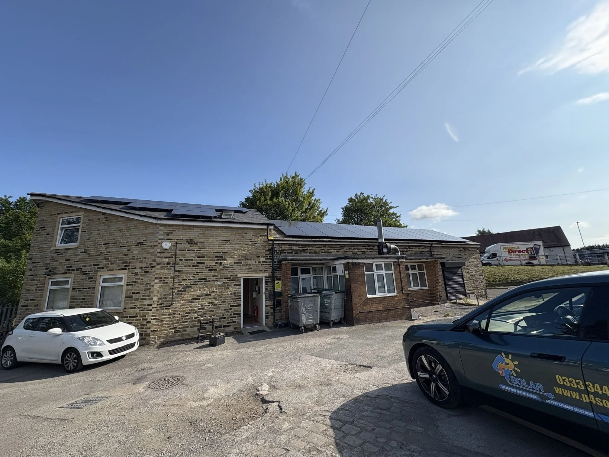 Residential-style commercial property fitted with roof-mounted solar panels by P4 Solar.