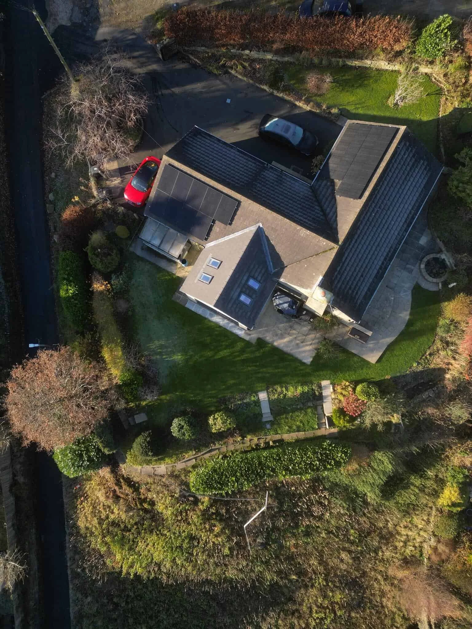 Aerial view of detached residential property with in-roof solar panels installed by P4 Solar
