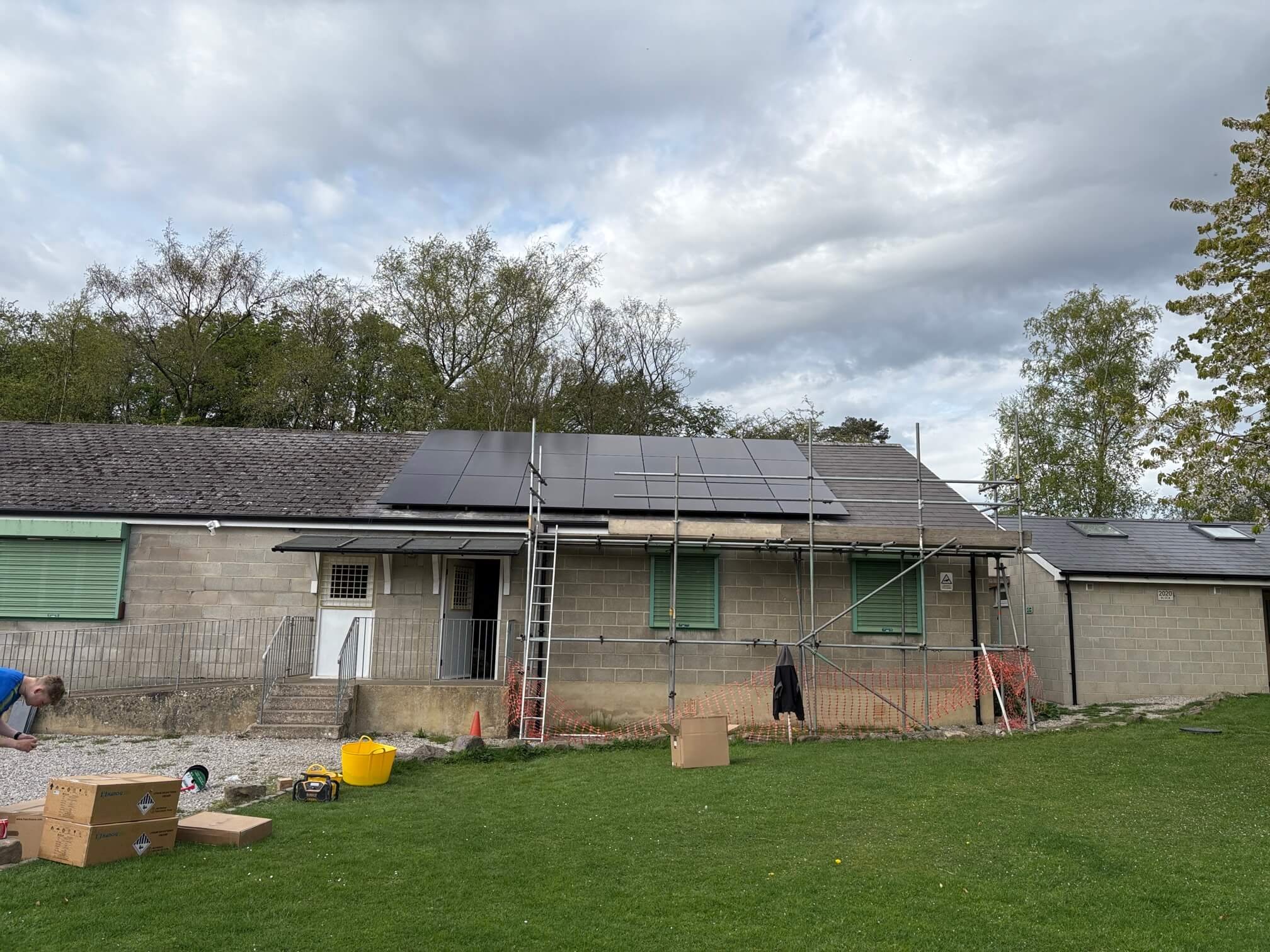 Solar panels and scaffolding on roof of Scouts centre in Ilkley