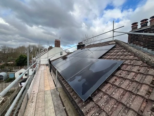 Aerial view of solar panels installed on a tiled roof, Manchester