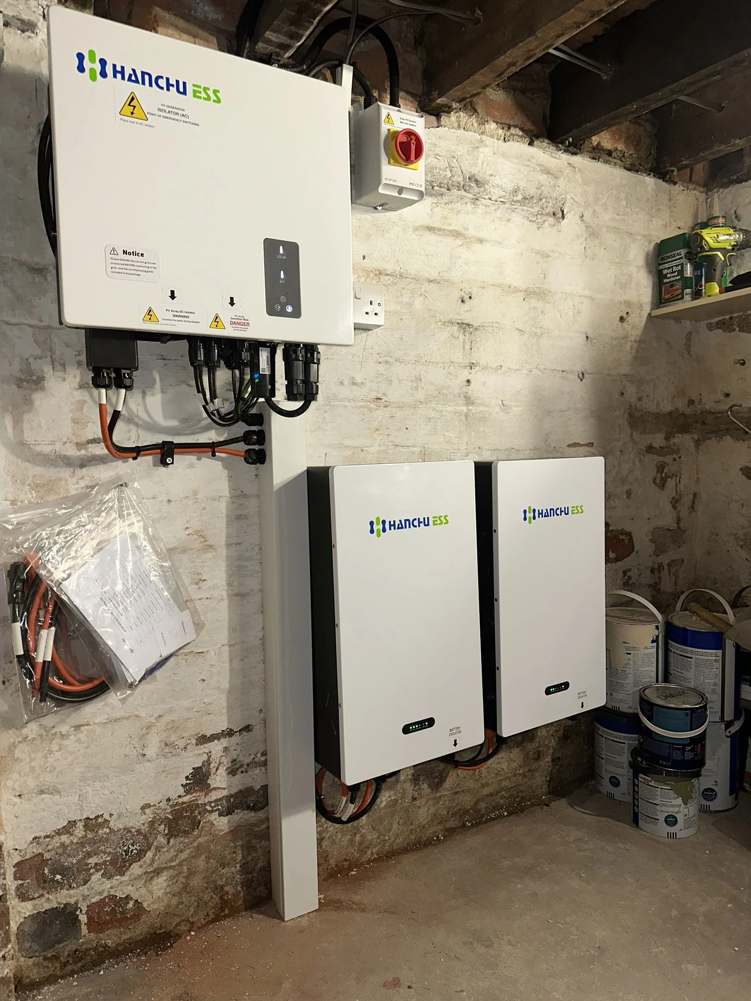 Solar inverter and Duracell battery storage units installed in a home utility room, Bradford