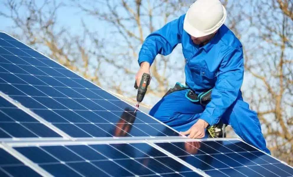 Solar panels installed on the roofs of newly built homes, illustrating domestic renewable energy generation