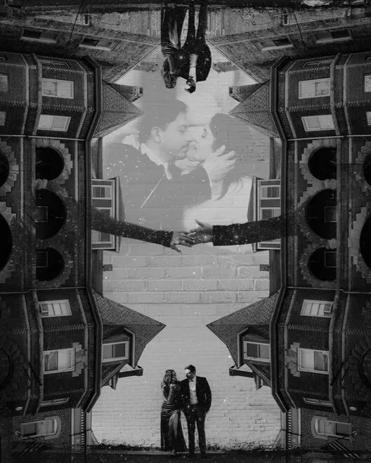 A black and white photo layered with multiple images, including a couple holding hands, a large face of a woman, and a person standing on the street, with architectural elements of houses surrounding the scene.